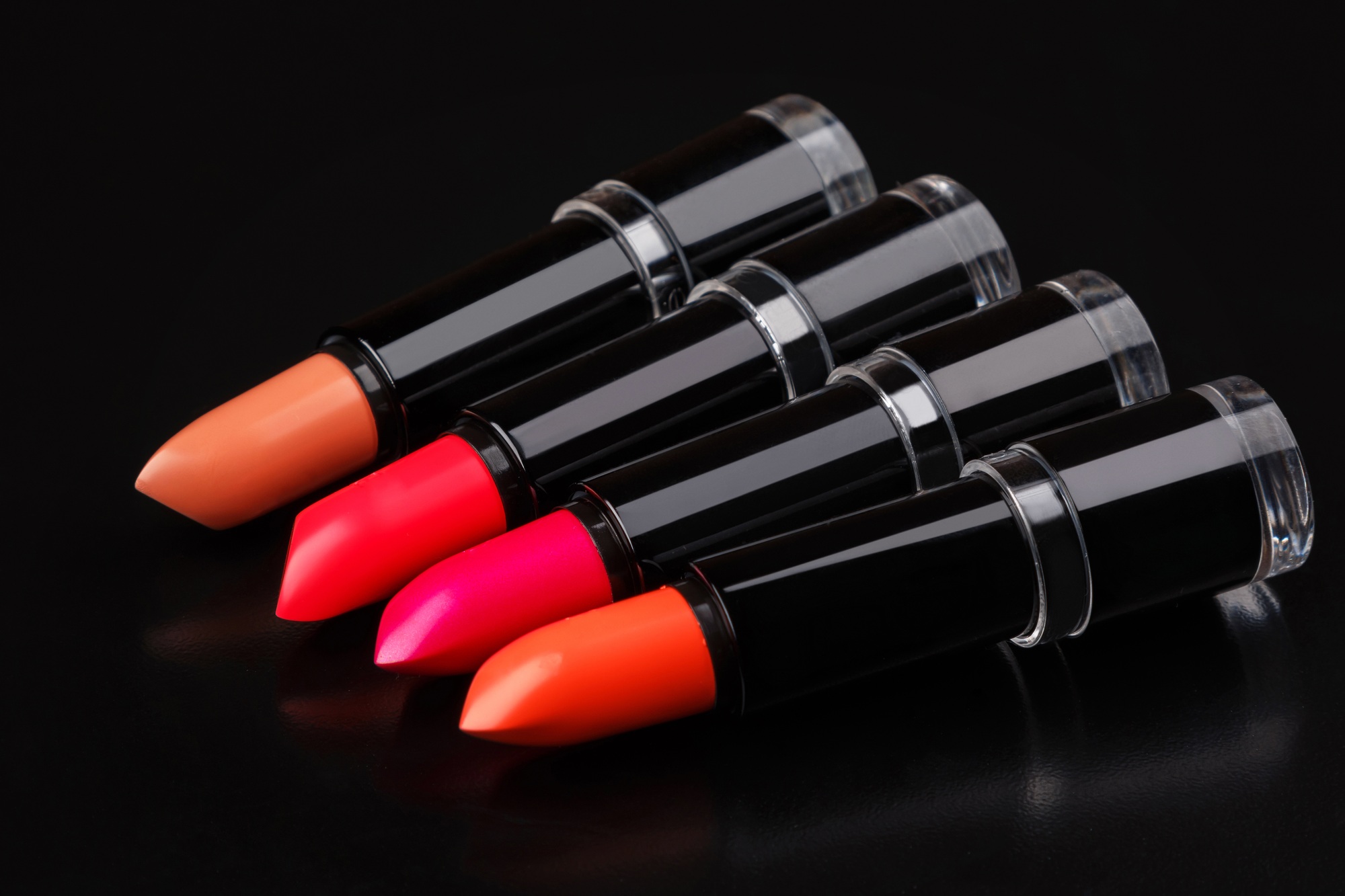 Colorful lipsticks on black